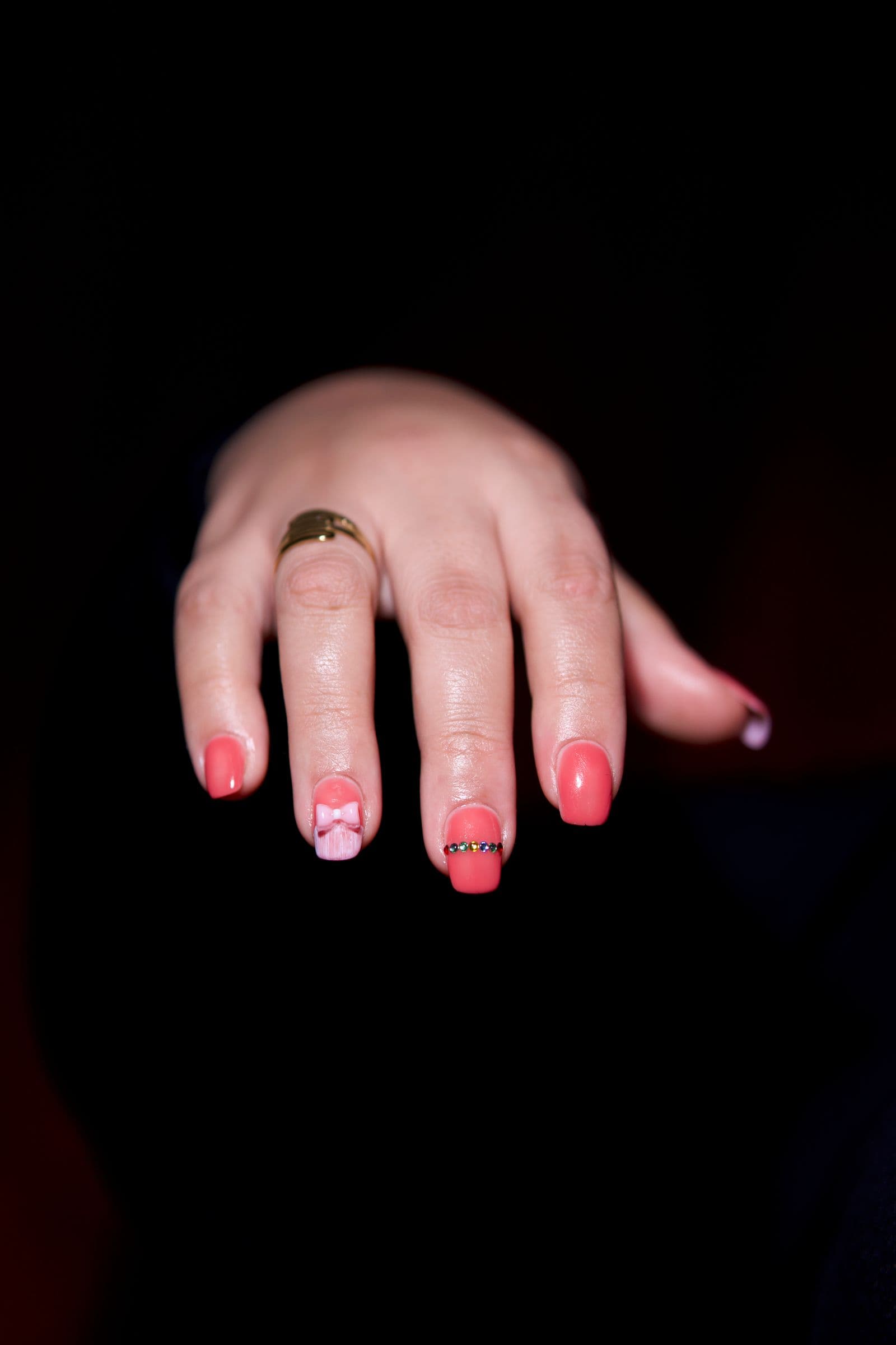 Pink nail-art close-up.